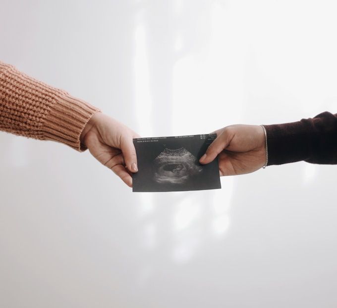 Sharing baby's first ultrasound keepsake · 30 weeks