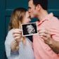 Couple with gender reveal scan